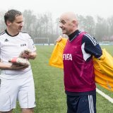 Swiss Gianni Infantino, new FIFA President, right, takes his jacket on next to Rinaldo Arnold, senior prosecutor for the Upper Valais, left, during a friendly football match at the Home of FIFA in Zurich, Switzerland, on Monday 29 February 2016. (KEYSTONE/Ennio Leanza)